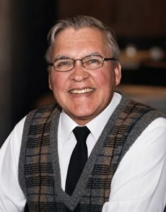 Charles J. “Chuck” Olmschek